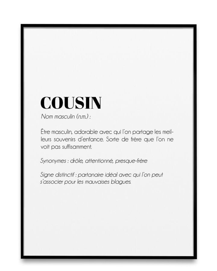 L’affiche Définition Cousin dans un cadre noir, sur fond blanc