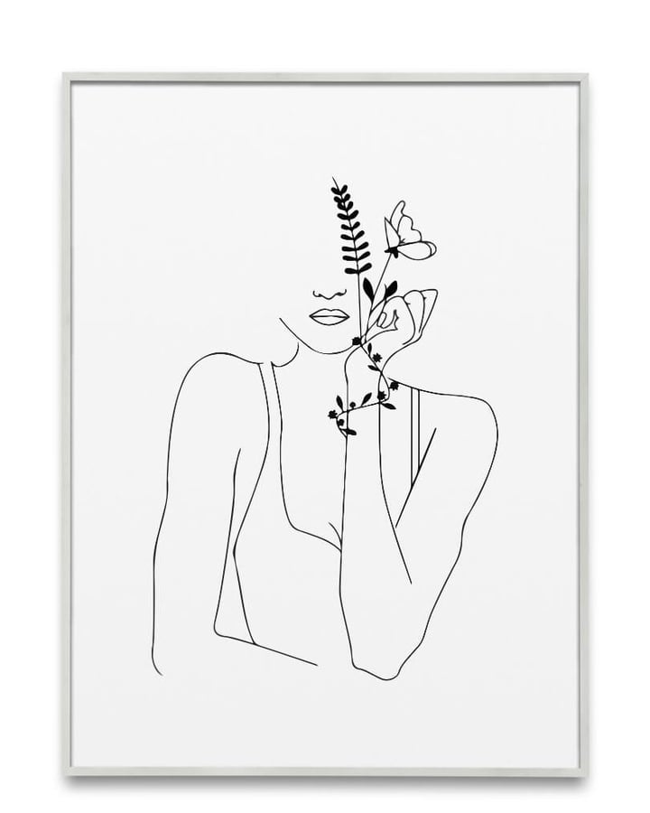 L’affiche La Jeune fille à la fleur dans un cadre clair, sur fond blanc